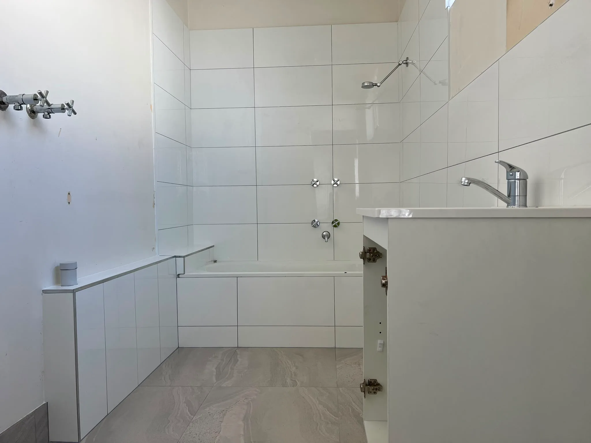 Bathroom reno — after, finished tiling