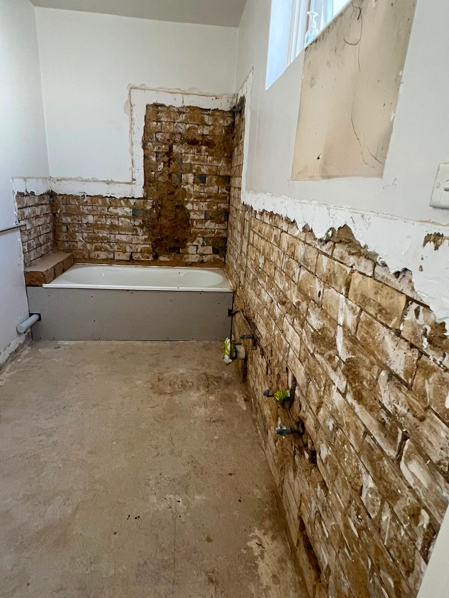 Bathroom before — strip-out