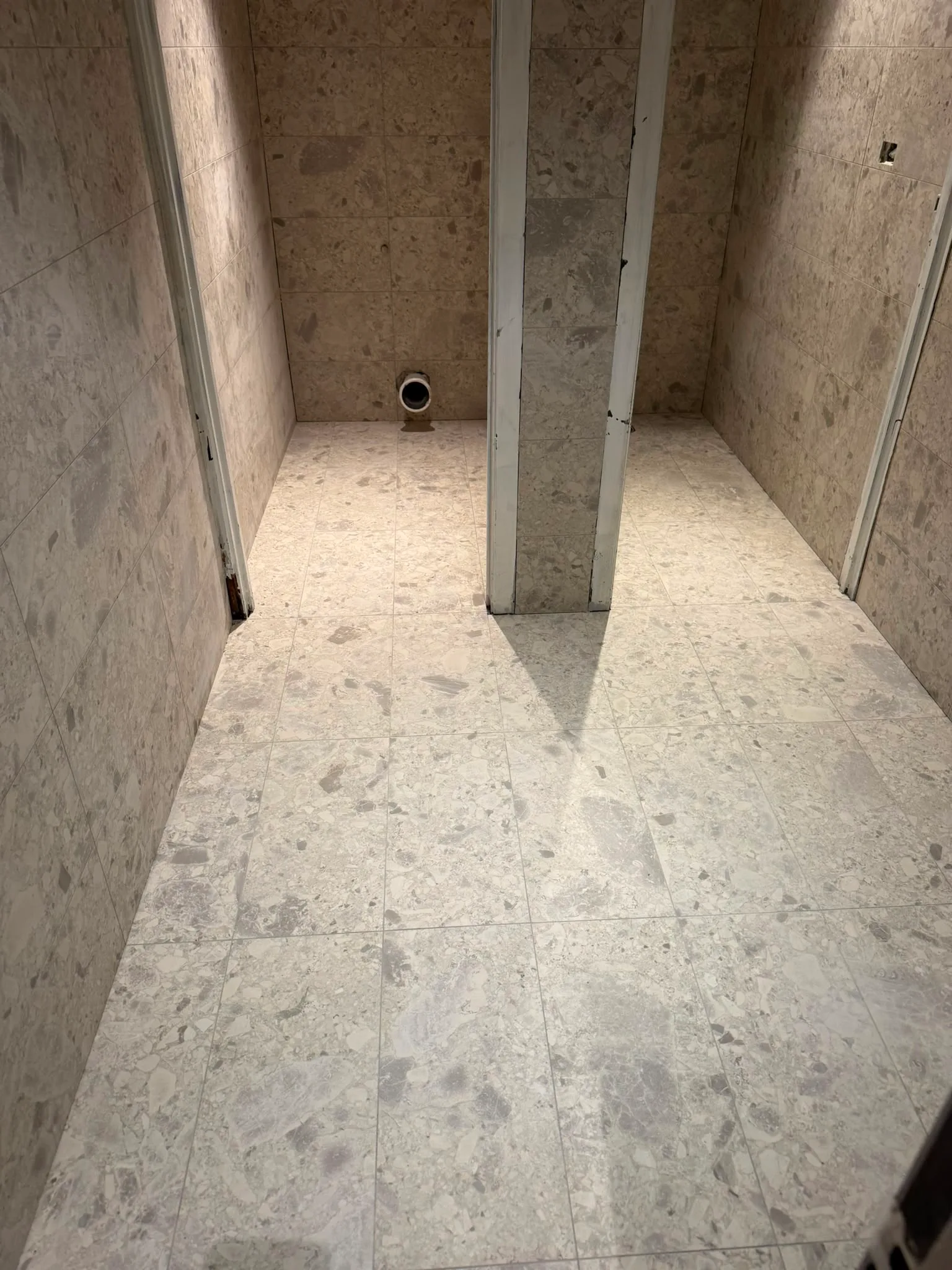 Commercial washroom — after, terrazzo tile