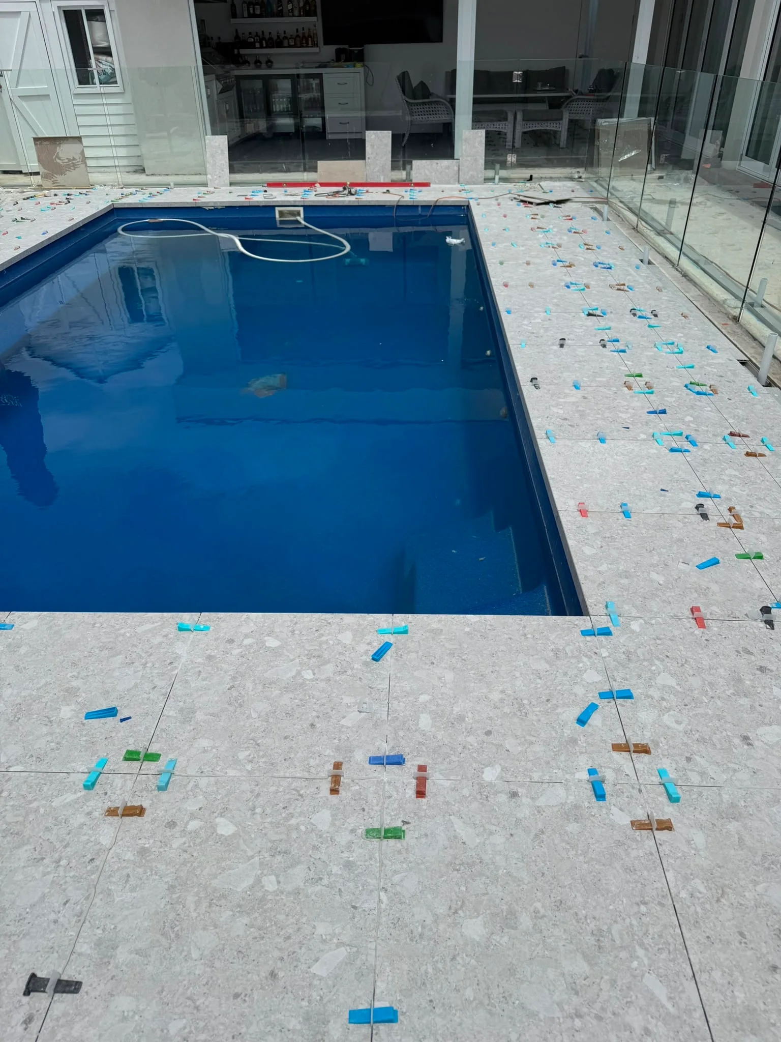 Pool surround tiling, wide shot