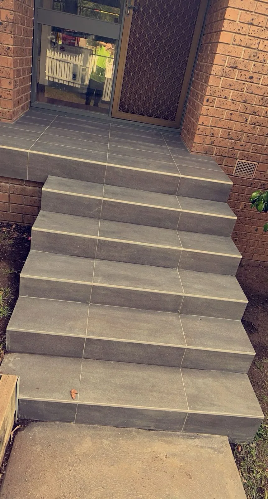 Front steps — after, dark grey tile