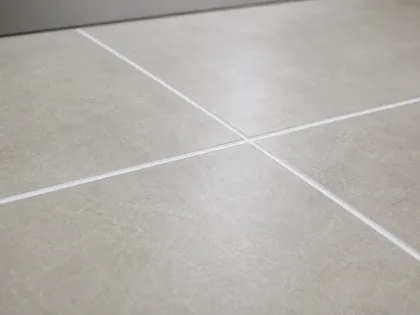 Close-up of freshly regrouted floor tile