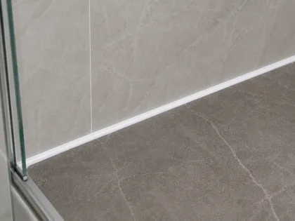 Close-up of a floor-to-wall silicone joint