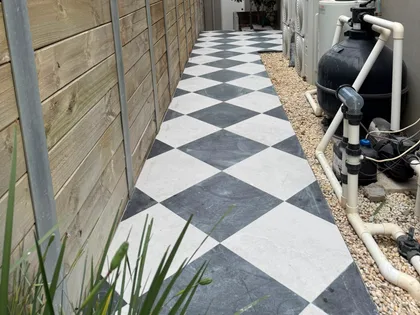 Repaired outdoor tiling, side path detail