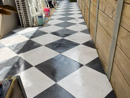 Repaired outdoor tiling, wider path detail
